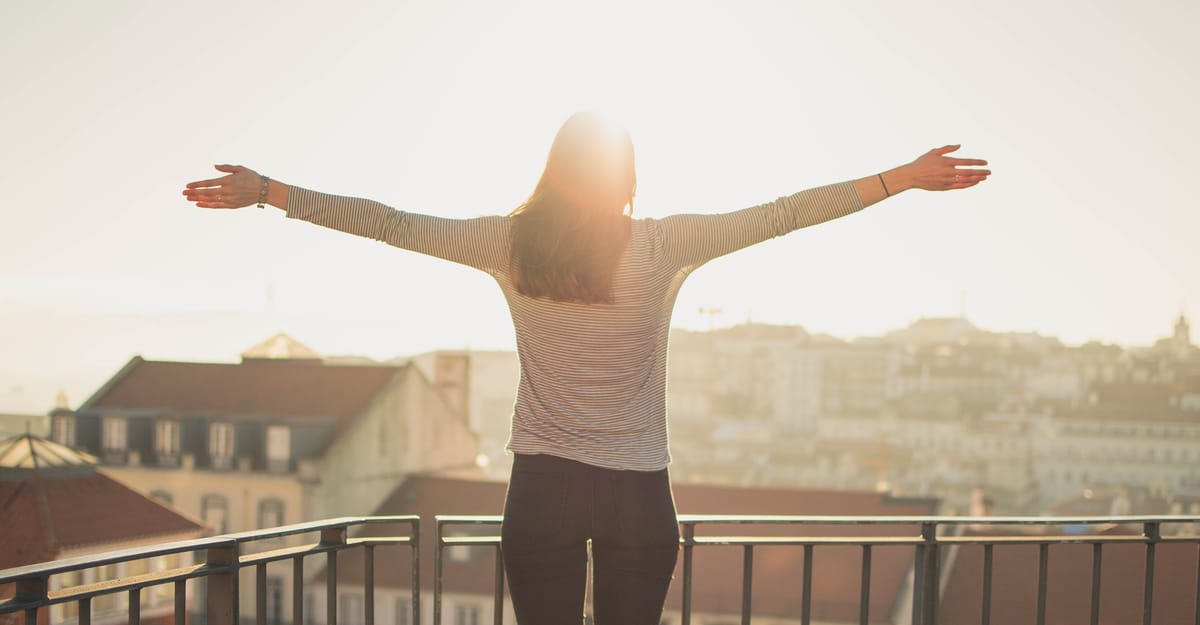 woman standing with light shining on her