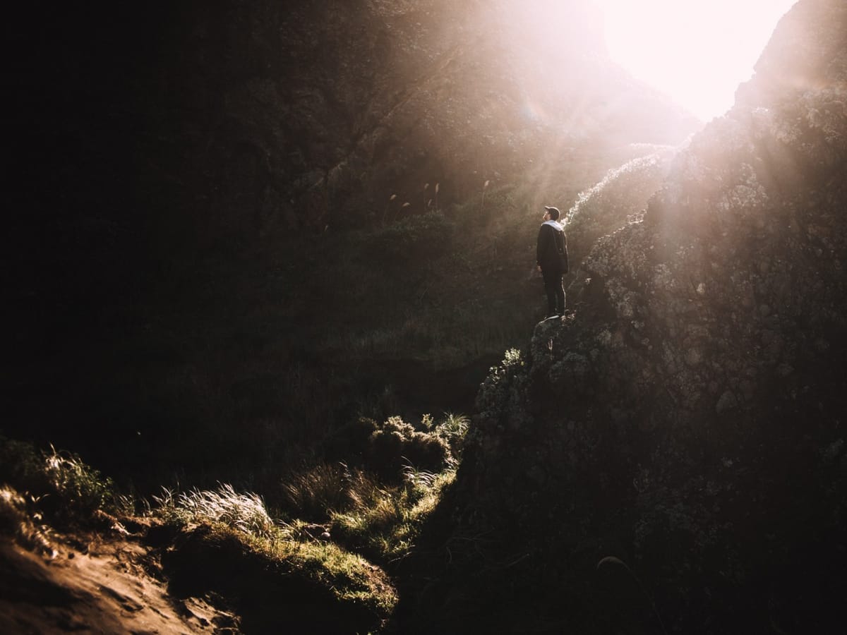 man standing in cave