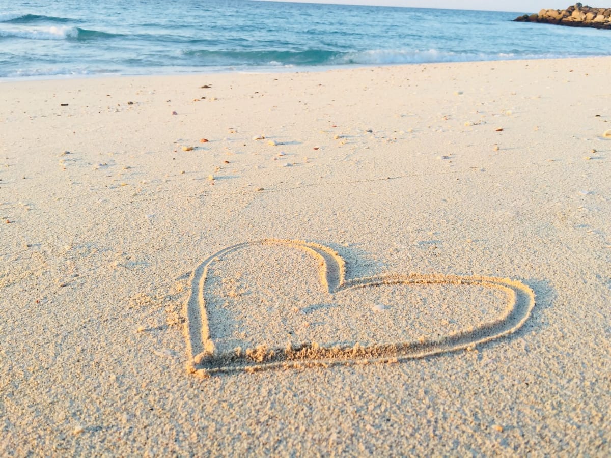 heart drawn in sand