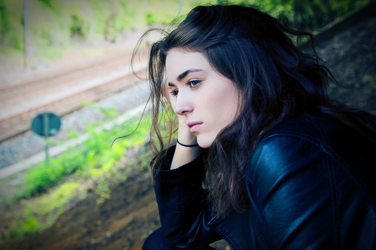 woman looking out window
