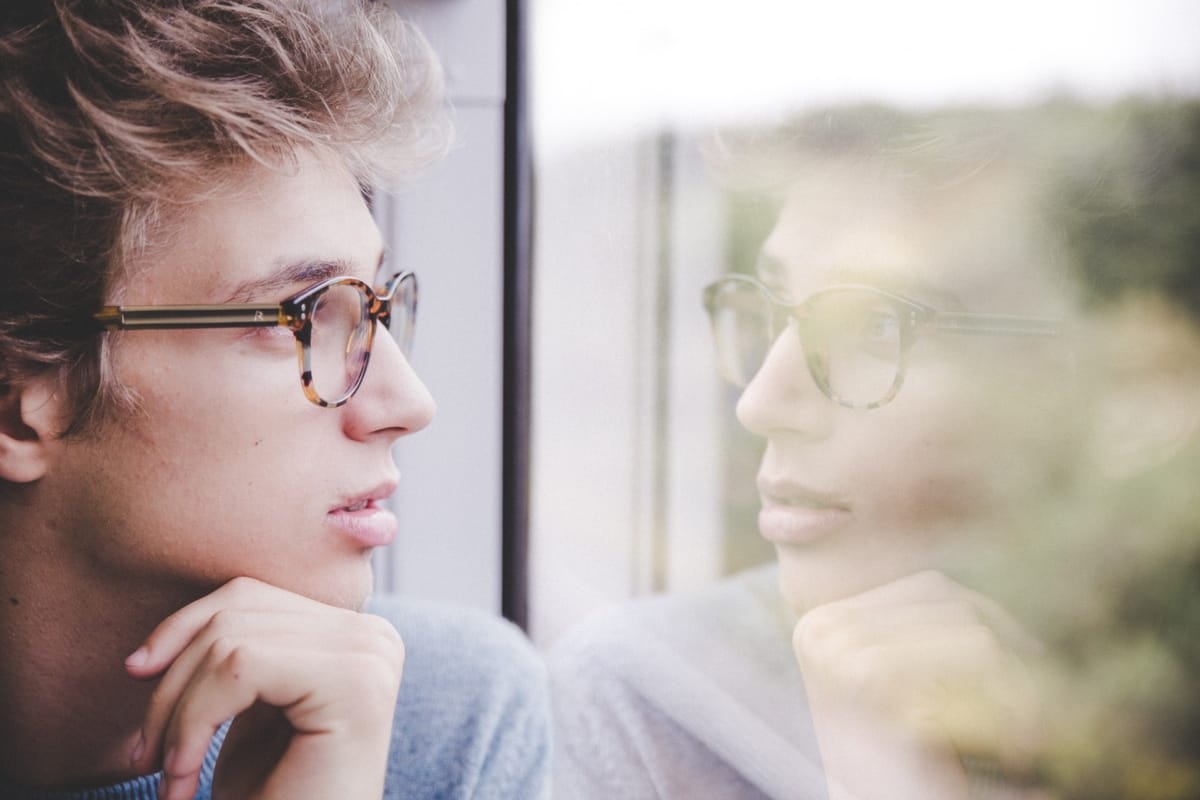 man looking in window