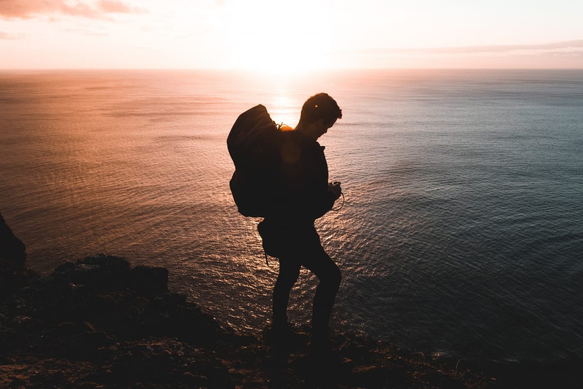 man backpacking