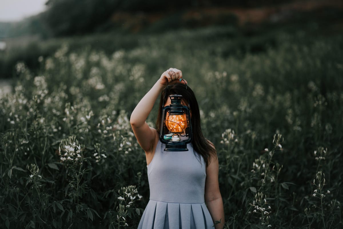 woman holding lantern