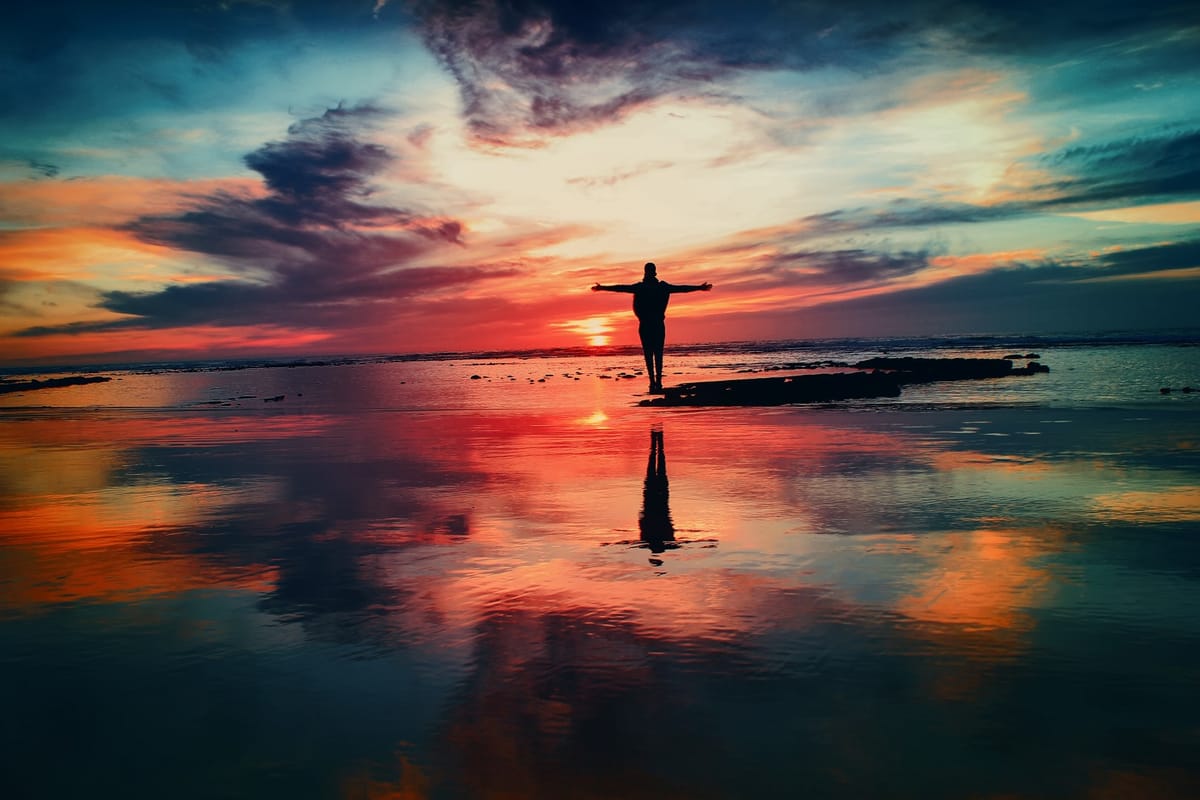 man standing at sunset
