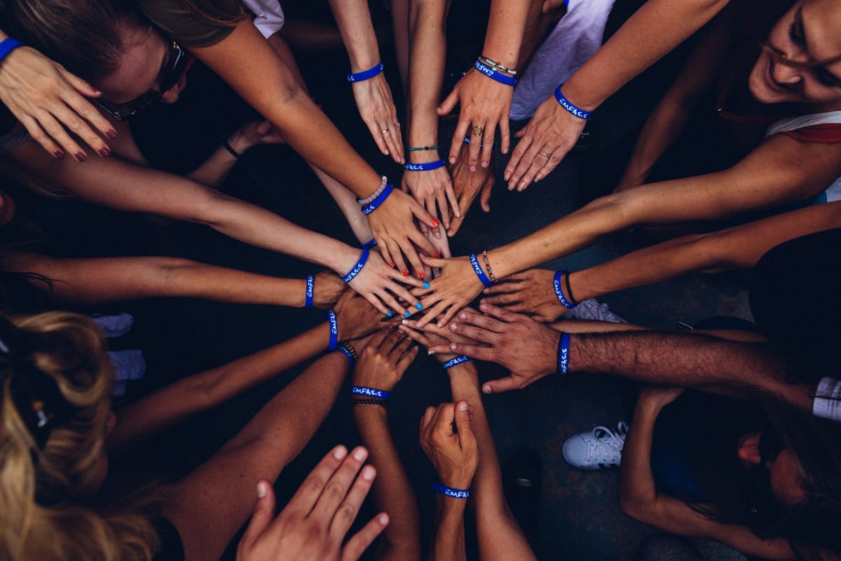 hands in circle teamwork