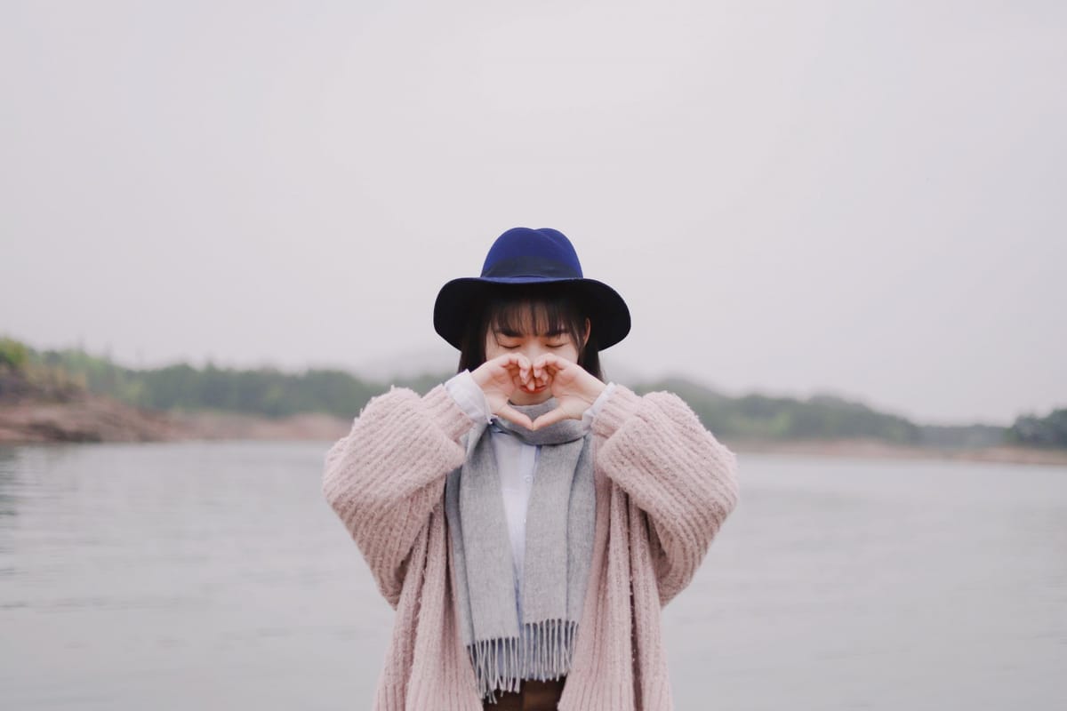 woman making heart sign