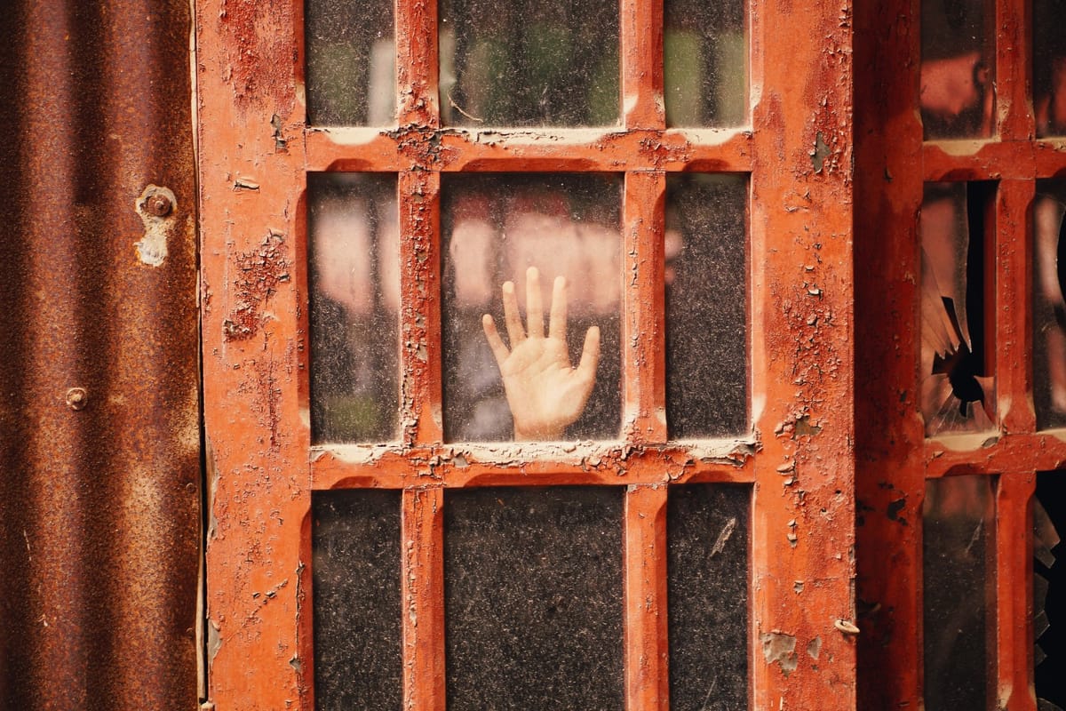 hand on frosted glass