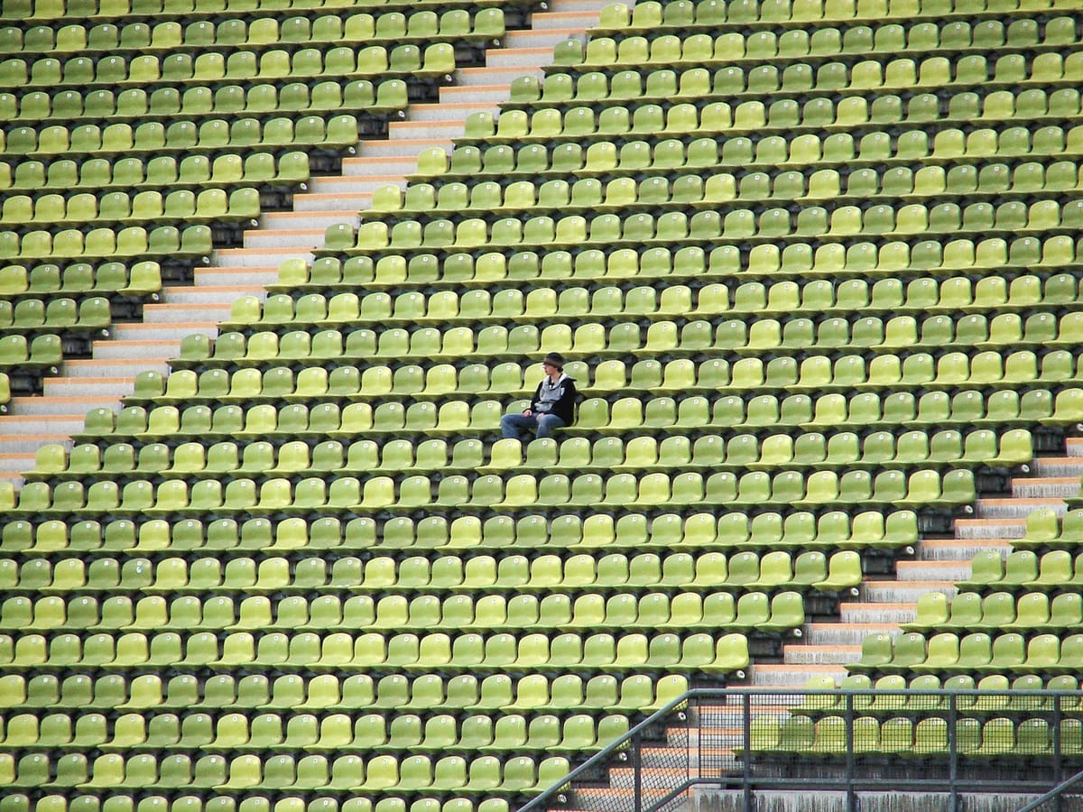 man alone in stadium