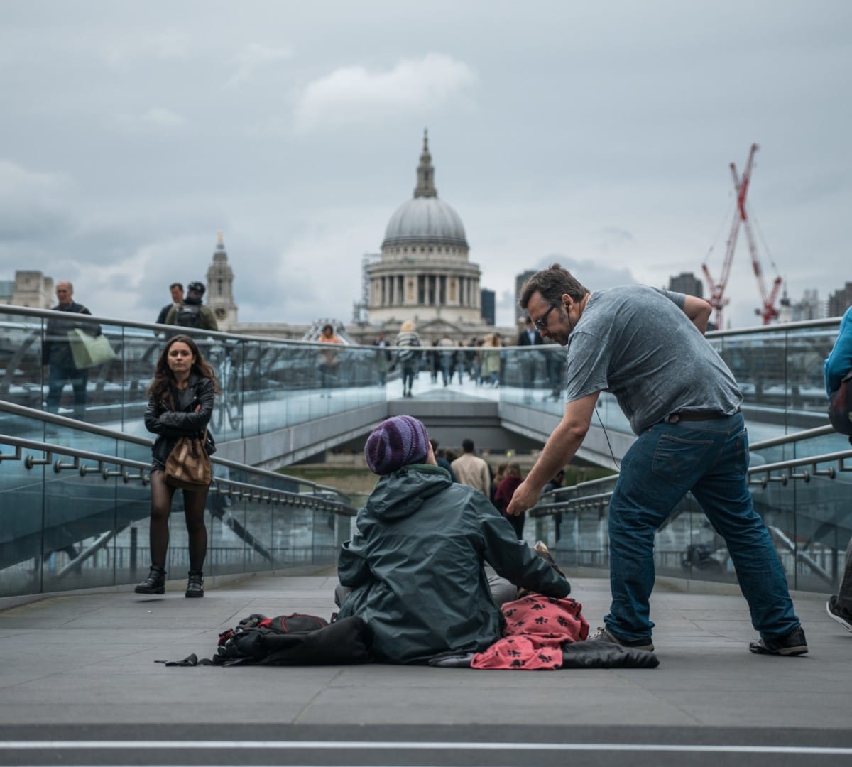 man helping homeless person