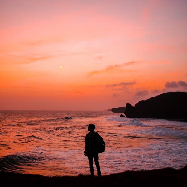 staring into sunset at beach