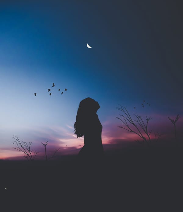 woman looking up at night sky