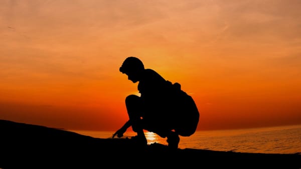 man kneeling praying beattidues
