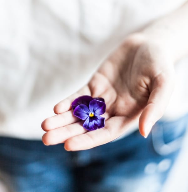 woman holding flower