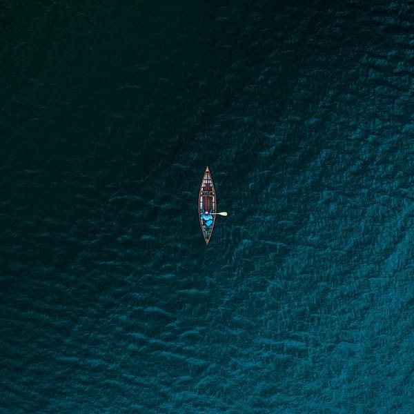 man in boat on ocean