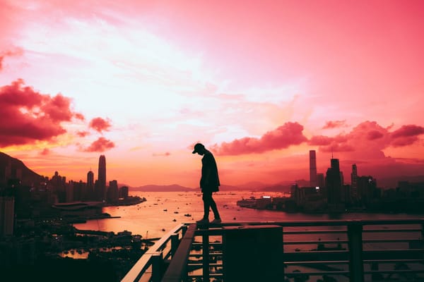 man walking at sunset