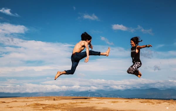 man and woman jumping