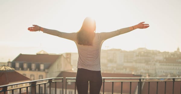 woman standing with light shining on her