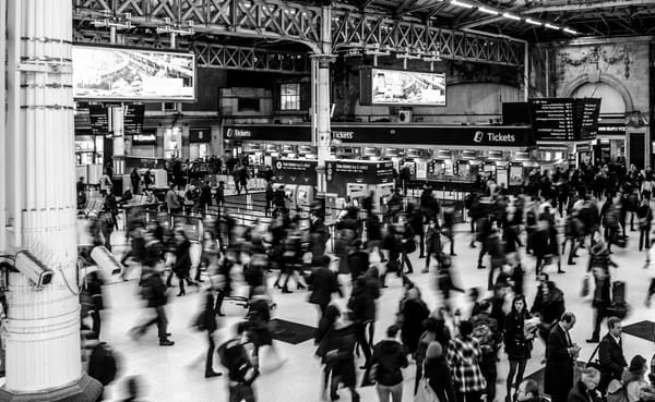 people busy in train station