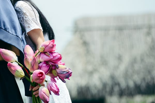 woman holding flowers