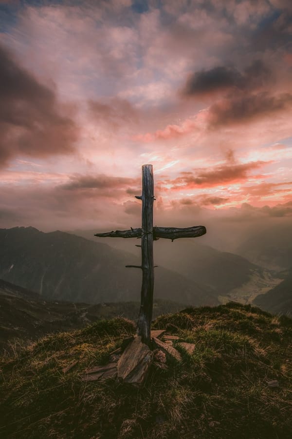 wooden cross with sunset
