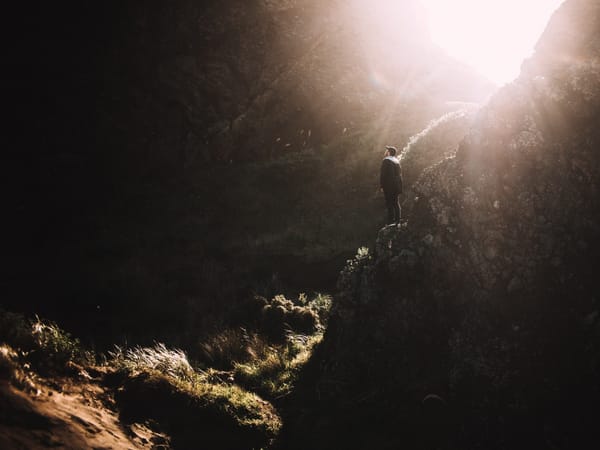 man standing in cave