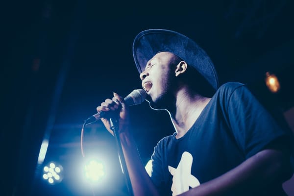 man singing into microphone