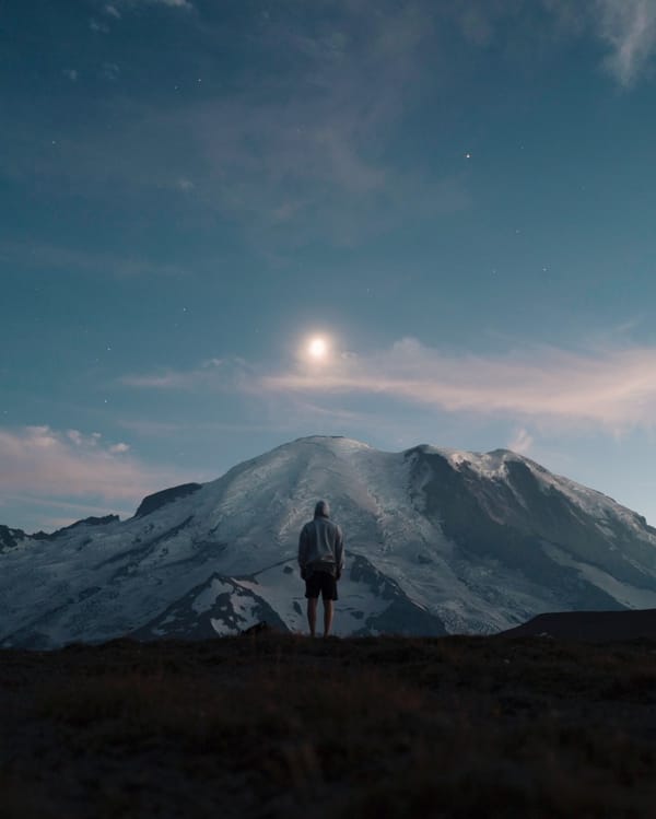 man standing on mountain