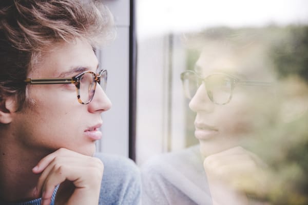 man looking in window