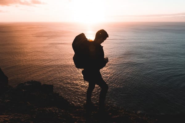 man backpacking