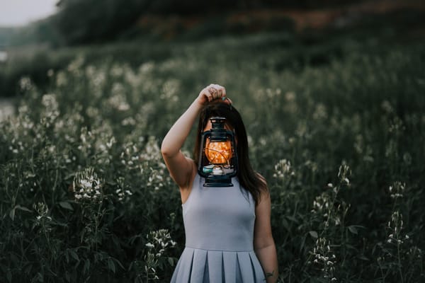 woman holding lantern