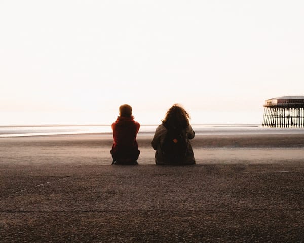 two women sitting together