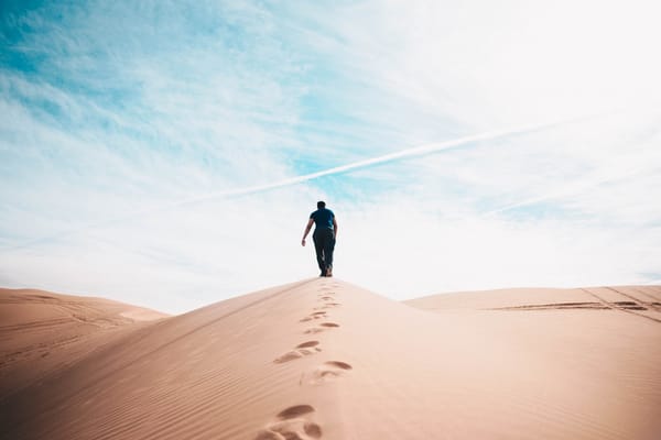 man climbing hill