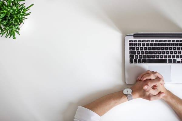 man waiting with laptop