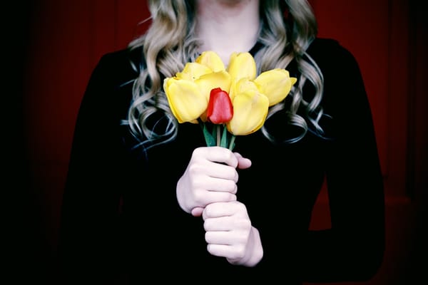 woman giving flowers