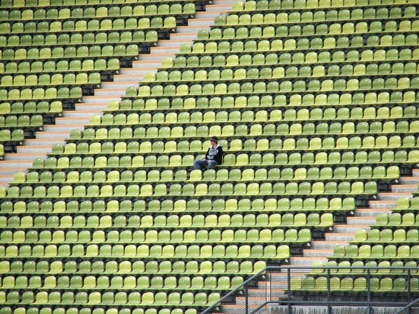 man alone in stadium